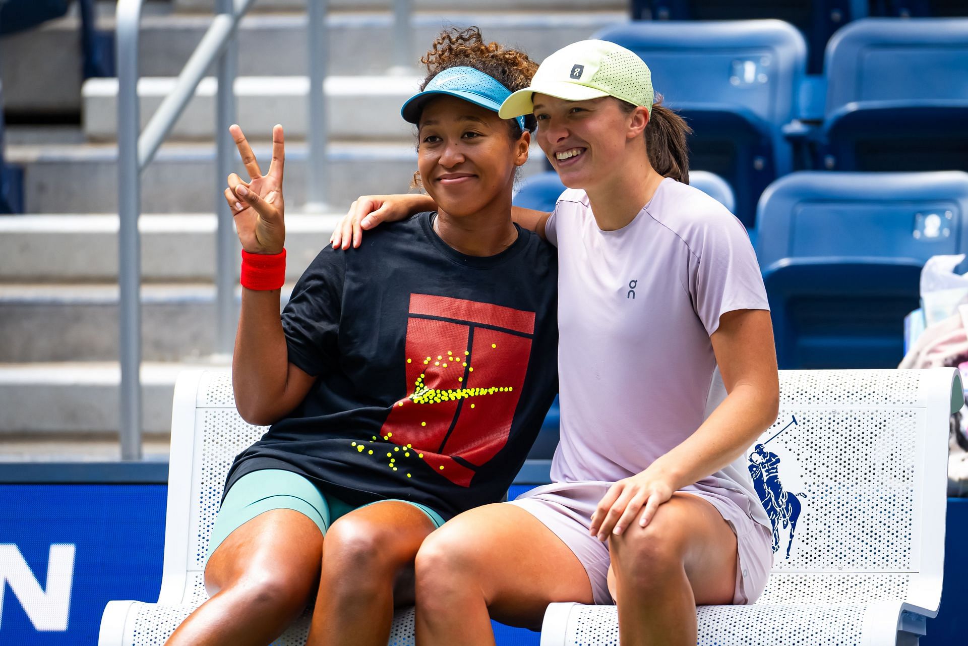 Naomi Osaka (L) pictured with Iga Swiatek during their 2024 US Open practice session - Source: Getty